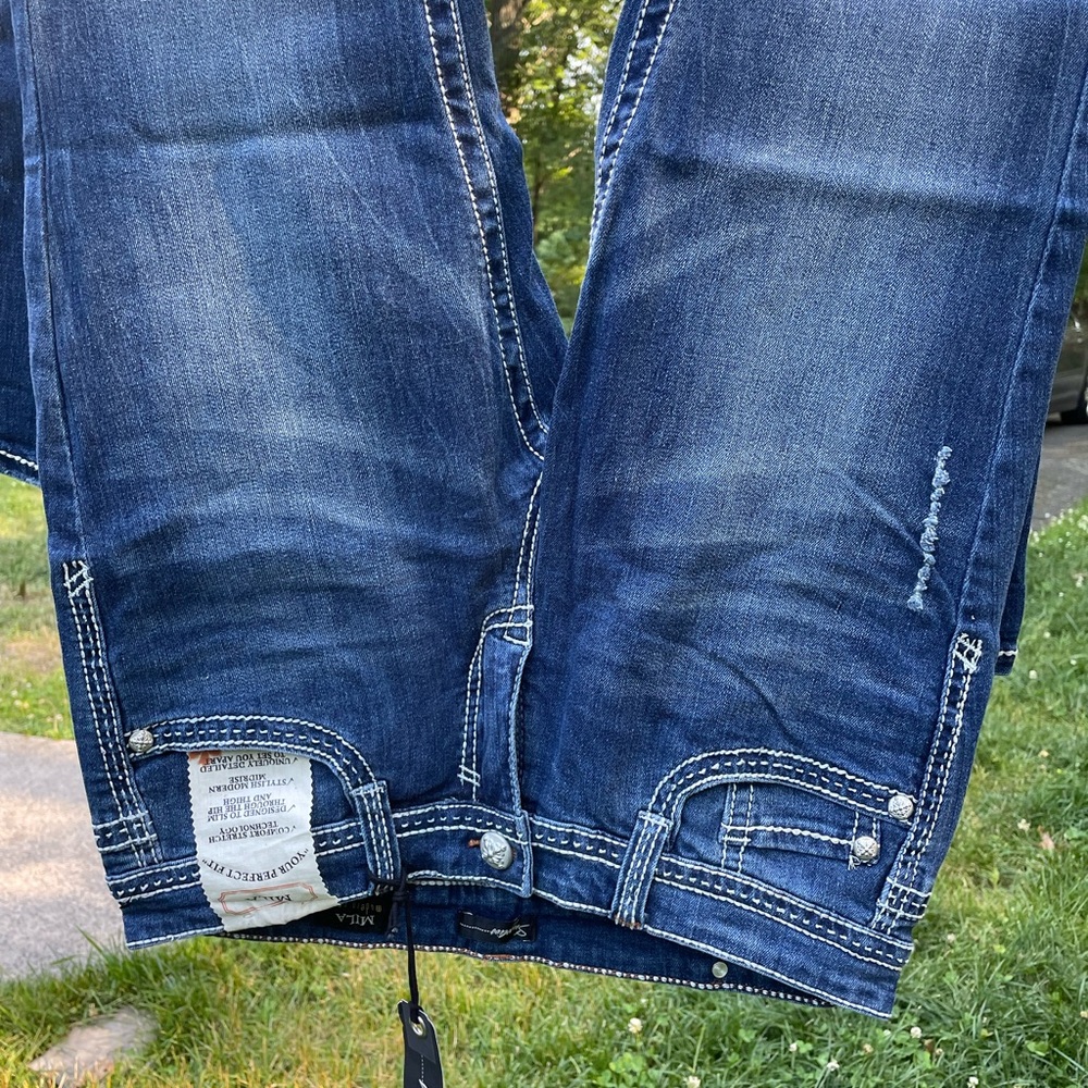 Signature Jeans. With Rose embossed buttons and rivets